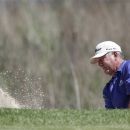Jay Haas hits out of the sand on the 18th hole during the first round of the Senior PGA Championship golf tournament at the Harbor Shores Golf Club in Benton Harbor, Mich., Thursday, May 24, 2012. (AP Photo/Carlos Osorio)