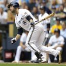 Milwaukee Brewers' Ryan Braun watches his RBI double against the Cincinnati Reds in the eighth inning of a baseball game, Wednesday, Aug. 8, 2012, in Milwaukee. (AP Photo/Jeffrey Phelps)