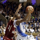 Duke's Rasheed Sulaimon (14) drives to the basket as Boston College's Ryan Anderson defends during the second half of an NCAA college basketball game in Durham, N.C., Sunday, Feb. 24, 2013. Duke won 89-68. (AP Photo/Gerry Broome)