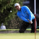 David Howell of England hits out of a bunker onto the 15th green during the third round of the European Masters golf tournament in the Swiss mountain resort of Crans-Montana September 1, 2012. REUTERS/Arnd Wiegmann