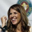 International Tennis Hall of Fame inductee Jennifer Capriati of Tampa, Fla. laughs during a news conference prior to induction ceremonies in Newport, R.I. Saturday, July 14, 2012. (AP Photo/Elise Amendola)