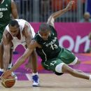 France's Boris Diaw, left, and Nigeria's Derrick Obasohan (13) chase a loose ball during a preliminary men's basketball game against France at the 2012 Summer Olympics, Monday, Aug. 6, 2012, in London. (AP Photo/Eric Gay)