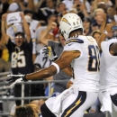 San Diego Chargers wide receiver Eddie Royal, right, celebrates his touchdown with Malcom Floyd against the Houston Texans during the first half of an NFL football game, Monday, Sept. 9, 2013, in San Diego. (AP Photo/Denis Poroy)