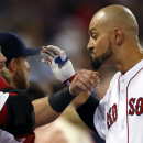 Boston Red Sox's Shane Victorino has his beard pulled by teammate Mike Napoli as he celebrates at the dugout after hitting a three-run homer against the Baltimore Orioles in the fifth inning of a baseball game at Fenway Park in Boston, Tuesday, Aug. 27, 2013. (AP Photo/Elise Amendola)