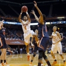 Tennessee's Kamiko Williams (4) shoots while defended by Auburn's Hasina Muhammad during their NCAA college basketball game, Thursday, Feb. 21, 2013, in Knoxville, Tenn. (AP Photo/The Knoxville News Sentinel, Saul Young)