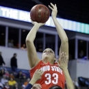 Ohio State center Ashley Adams (33) goes up for a shot against Penn State guard Dara Taylor (2) during the first half of an NCAA women's college basketball game in the Big Ten Conference tournament in Hoffman Estates, Ill., on Friday, March 8, 2013. (AP Photo/Nam Y. Huh)