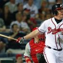 Atlanta Braves' Chipper Jones follows through with a game-winning, two-run home run in the 10th inning of a baseball game against the Philadelphia Phillies in Atlanta, Wednesday, May 2, 2012. Atlanta won 15-13. (AP Photo/John Bazemore)