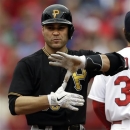 Pittsburgh Pirates' Russell Martin signals to the Pirates' dugout after hitting a double during the fourth inning of a baseball game against the St. Louis Cardinals, Sunday, April 28, 2013, in St. Louis. (AP Photo/Jeff Roberson)