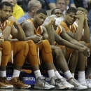 Texas players sit on the bench during the final minutes of an NCAA college basketball game in the Big 12 tournament on Thursday, March 14, 2013, in Kansas City, Mo. Kansas State defeated Texas 66-49. (AP Photo/Orlin Wagner)
