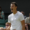 Bernard Tomic of Australia reacts after winning the third set as he plays Richard Gasquet of France during their Men's singles match at the All England Lawn Tennis Championships in Wimbledon, London, Saturday, June 29, 2013. (AP Photo/Sang Tan)