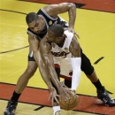 San Antonio Spurs' Tim Duncan and the Miami Heat's Dwyane Wade, front, work during the first half in Game 7 of the NBA basketball championships, Thursday, June 20, 2013, in Miami. (AP Photo/Wilfredo Lee)