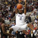 FILE - This Dec. 8, 2011 file photo shows Connecticut's Andre Drummond dunking in front of Harvard's Keith Wright (44) during the first half of an NCAA college basketball game in Storrs, Conn. Drummond is a possible pick in the NBA Draft on Jan. 28. (AP Photo/Bob Child, File)