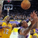 Phoenix Suns guard Shannon Brown, right, puts up a shot as Los Angeles Lakers center Dwight Howard defends during the first half of their NBA basketball game, Friday, Nov. 16, 2012, in Los Angeles. (AP Photo/Mark J. Terrill)