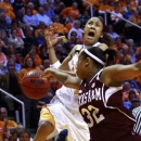 Tennessee guard Meighan Simmons (10) is fouled by Texas A&M guard Adrienne Pratcher (32) in the first half of an NCAA college basketball game, Thursday, Feb. 28, 2013, in Knoxville, Tenn. (AP Photo/Wade Payne)