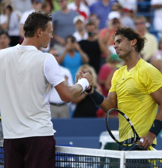 Rafael Nadal, of Spain, shakes hands with Tomas Berdych, of the Czech Republic, after a semifinal at the Western & Southern Open tennis tournament, Saturday, Aug. 17, 2013, in Mason, Ohio. Nadal won 7-5, 7-6 (4)