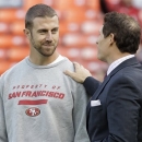 FILE - In this Nov. 19, 2012 file photo, San Francisco 49ers quarterback Alex Smith, left, talks with former quarterback and NFL broadcaster Steve Young before an NFL football game against the Chicago Bears in San Francisco. A person with knowledge of the trade tells The Associated Press that the Kansas City Chiefs have agreed to acquire Smith from San Francisco. The person spoke on condition of anonymity on Wednesday, Feb. 27, 2013, because the trade does not become official until March 12, when the NFL's new business year begins. (AP Photo/Tony Avelar, File)