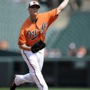Baltimore Orioles starting pitcher Zach Britton delivers a pitch against the Chicago White Sox during the first inning of a baseball game, Thursday, Aug. 30, 2012, in Baltimore. (AP Photo/Nick Wass)