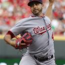 Washington Nationals starting pitcher Gio Gonzalez throws against the Cincinnati Reds during the first inning of a baseball game on Friday, May 11, 2012, in Cincinnati. (AP Photo/David Kohl)
