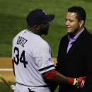 Detroit Tigers' Miguel Cabrera chats with Boston Red Sox's David Ortiz after he was awarded the 2013 Hank Aaron Award before Game 4 of baseball's World Series between the St. Louis Cardinals and the Boston Red Sox, Sunday, Oct. 27, 2013, in St. Louis. (AP Photo/Charlie Neibergall)