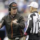 Cleveland Browns head coach Pat Shurmur, left, argues a call with referee Clete Blakeman (34) during the first half of an NFL football game on Sunday, Oct. 7, 2012, in East Rutherford, N.J. (AP Photo/Kathy Willens)