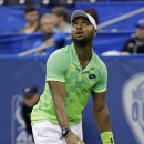 Donald Young serves to Kevin Anderson, of South Africa, in a semifinal round tennis match at the Memphis Open, Saturday, Feb. 14, 2015, in Memphis, Tenn. (AP Photo/Mark Humphrey)