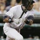New York Yankees' Curtis Granderson doubles to center field in the seventh inning of a baseball game against the Detroit Tigers, Wednesday, Aug. 8, 2012, in Detroit. Granderson hit his 30th home run and drove in four run in the Yankees' 12-8 win. (AP Photo/Duane Burleson)