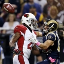 St. Louis Rams wide receiver Danny Amendola, right, catches a 44-yard pass as Arizona Cardinals cornerback Patrick Peterson defends during the first quarter of an NFL football game, Thursday, Oct. 4, 2012, in St. Louis. (AP Photo/Jeff Roberson)