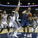 Minnesota Timberwolves center Nikola Pekovic (14), of Montenegro, goes to the basket against Memphis Grizzlies defenders Austin Daye (5), Darrell Arthur (00), Marc Gasol (33) of Spain, and Mike Conley, right, in the first half of an NBA basketball game on Sunday Feb. 10, 2013, in Memphis, Tenn. (AP Photo/Lance Murphey)