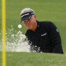 Darren Clarke of Northern Ireland hits from a sand trap on the second green during second round play in the 2012 Masters Golf Tournament at the Augusta National Golf Club in Augusta, Georgia, April 6, 2012. REUTERS/Phil Noble