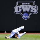 Florida right fielder Preston Tucker can't reach an RBI single by Kent State's George Roberts in the first inning of an NCAA College World Series elimination baseball game in Omaha, Neb., Monday, June 18, 2012. Jimmy Rider scored on the play. (AP Photo/Eric Francis)