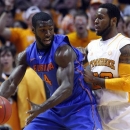 Florida center Patric Young (4) works against Tennessee forward Kenny Hall (20) in the first half of an NCAA college basketball game on Tuesday, Feb. 26, 2013, in Knoxville, Tenn. (AP Photo/Wade Payne)