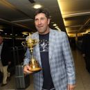 Team Europe Ryder Cup captain Jose Maria Olazabal of Spain poses with the trophy after he arrived at London's Heathrow Airport late Monday, Oct. 1, 2012. The European Ryder Cup team beat the Americans in the golf tournament by 14-1/2 to 13-1/2 to retain the trophy Sunday at the Medinah Country Club in Medinah, Illinois, USA. (AP Photo) UNITED KINGDOM OUT NO SALES NO MAGS