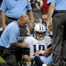 Tennessee Titans quarterback Jake Locker (10) is helped off the field after being sacked by Houston Texans strong safety Glover Quin in the first quarter of an NFL football game Sunday, Sept. 30, 2012, in Houston. (AP Photo/Dave Einsel)