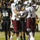 South Carolina's Marcus Lattimore (21) celebrates his game-winning touchdown with teammates in the second half of an NCAA college football game, Thursday, Aug. 30, 2012, in Nashville, Tenn. South Carolina won 17-13. (AP Photo/John Russell)