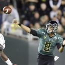Oregon quarterback Marcus Mariota unleashes a pass during the first half of their NCAA college football game against Arizona in Eugene, Ore., Saturday, Sept. 22, 2012. (AP Photo/Don Ryan)