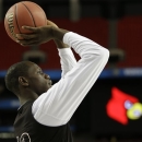 Louisville's Gorgui Dieng shoots during practice for their NCAA Final Four tournament college basketball semifinal game against Wichita State, Friday, April 5, 2013, in Atlanta. Louisville plays Wichita State in a semifinal game on Saturday. (AP Photo/David J. Phillip)