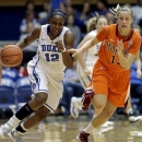 Duke's Chelsea Gray (12) is chased by Virginia Tech's Alyssa Fenyn during the first half of an NCAA college basketball game in Durham, N.C., Wednesday, Jan. 16, 2013. (AP Photo/Gerry Broome)