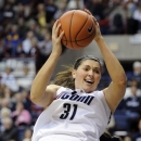 Connecticut's Stefanie Dolson is fouled by Seton Hall's Brittany Morris during the first half of an NCAA college basketball game in Storrs, Conn., Saturday, Feb. 23, 2013. (AP Photo/Fred Beckham)