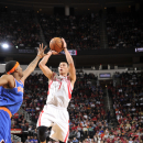 HOUSTON, TX - NOVEMBER 23: Jeremy Lin #7 of the Houston Rockets shoots the ball over Carmelo Anthony #7 of the New York Knicks on November 23, 2012 at the Toyota Center in Houston, Texas. (Photo by Bill Baptist/NBAE via Getty Images)