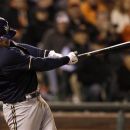 Milwaukee Brewers' Aramis Ramirez hits a two-run single off of San Francisco Giants pitcher Sergio Romo during the seventh inning of a baseball game in San Francisco, Friday, May 4, 2012. (AP Photo/Jeff Chiu)