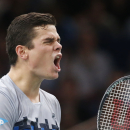 Milos Raonic of Canada celebrates his victory over Roger Federer of Switzerland during their quarterfinal match at the ATP World Tour Masters tennis tournament at Bercy stadium in Paris, France, Friday, Oct. 31, 2014. Raonic won 7-6, 7-5. (AP Photo/Michel Euler)