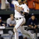 Baltimore Orioles' Manny Machado reacts as he scores on a single by Nate McLouth in the ninth inning of a baseball game against the Tampa Bay Rays in Baltimore, Wednesday, Sept. 12, 2012. Baltimore won 3-2. (AP Photo/Patrick Semansky)