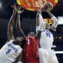 Houston forward Mikhail McLean (1) fights for a rebound against Memphis defenders D.J. Stephens (30), and Shaq Goodwin (5) during the first half of an NCAA college basketball game on Wednesday, Feb. 20, 2013, in Memphis, Tenn. (AP Photo/Lance Murphey)