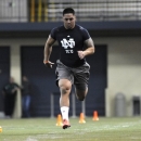 Linebacker Manti Te'o runs the 40-yard dash during Notre Dame's pro day for NFL scouts, Tuesday March 26, 2013 in South Bend, Ind. (AP Photo/Joe Raymond)