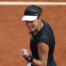 Serbia's Ana Ivanovic clenches her fist as she plays Croatia's Donna Vekic during their third round match of the French Open tennis tournament at the Roland Garros stadium, Friday, May 29, 2015 in Paris. Ivanovic won 6-0, 6-3. (AP Photo/Francois Mori)