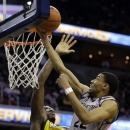 Georgetown forward Otto Porter Jr. (22) shoots over Marquette center Chris Otule (42) during the second half of an NCAA college basketball game, Monday, Feb. 11, 2013, in Washington. Porter had 21 points, and Georgetown won 63-55. (AP Photo/Alex Brandon)