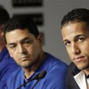 Toronto Blue Jays' Yunel Escobar, right, appears alongside manager John Farrell, left, and coach Luis Rivera, center, at a news conference before a baseball game against the New York Yankees at Yankee Stadium in New York, Tuesday, Sept. 18, 2012. Escobar addressed his decision to play with eye-black displaying a homophobic slur in Spanish in a baseball game against the Boston Red Sox on Saturday, Sept. 15. Escobar will serve a three-game suspension. (AP Photo/Kathy Willens)