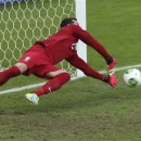 Brazil goalkeeper Julio Cesar saves a penalty during the soccer Confederations Cup semifinal match between Brazil and Uruguay at the Mineirao stadium in Belo Horizonte, Brazil, Wednesday, June 26, 2013. (AP Photo/Andre Penner)