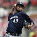 Milwaukee Brewers starting pitcher Yovani Gallardo throws during the first inning of a baseball game against the St. Louis Cardinals, Saturday, April 13, 2013, in St. Louis. (AP Photo/Jeff Roberson)