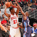 CHICAGO, IL - JANUARY 28: Jimmy Butler #21 of the Chicago Bulls looks to pass the ball against Ben Gordon #8 of the Charlotte Bobcats on January 28, 2013 at the United Center in Chicago, Illinois. (Photo by Ray Amati/NBAE via Getty Images)